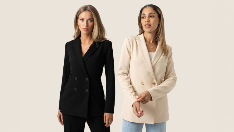 Two women stood in a black double breasted blazer and one in a cream double breasted blazer