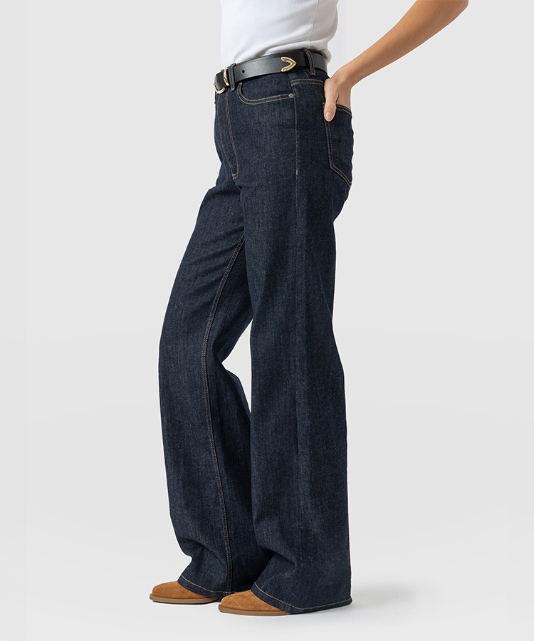Wide leg jeans in a dark blue wash.