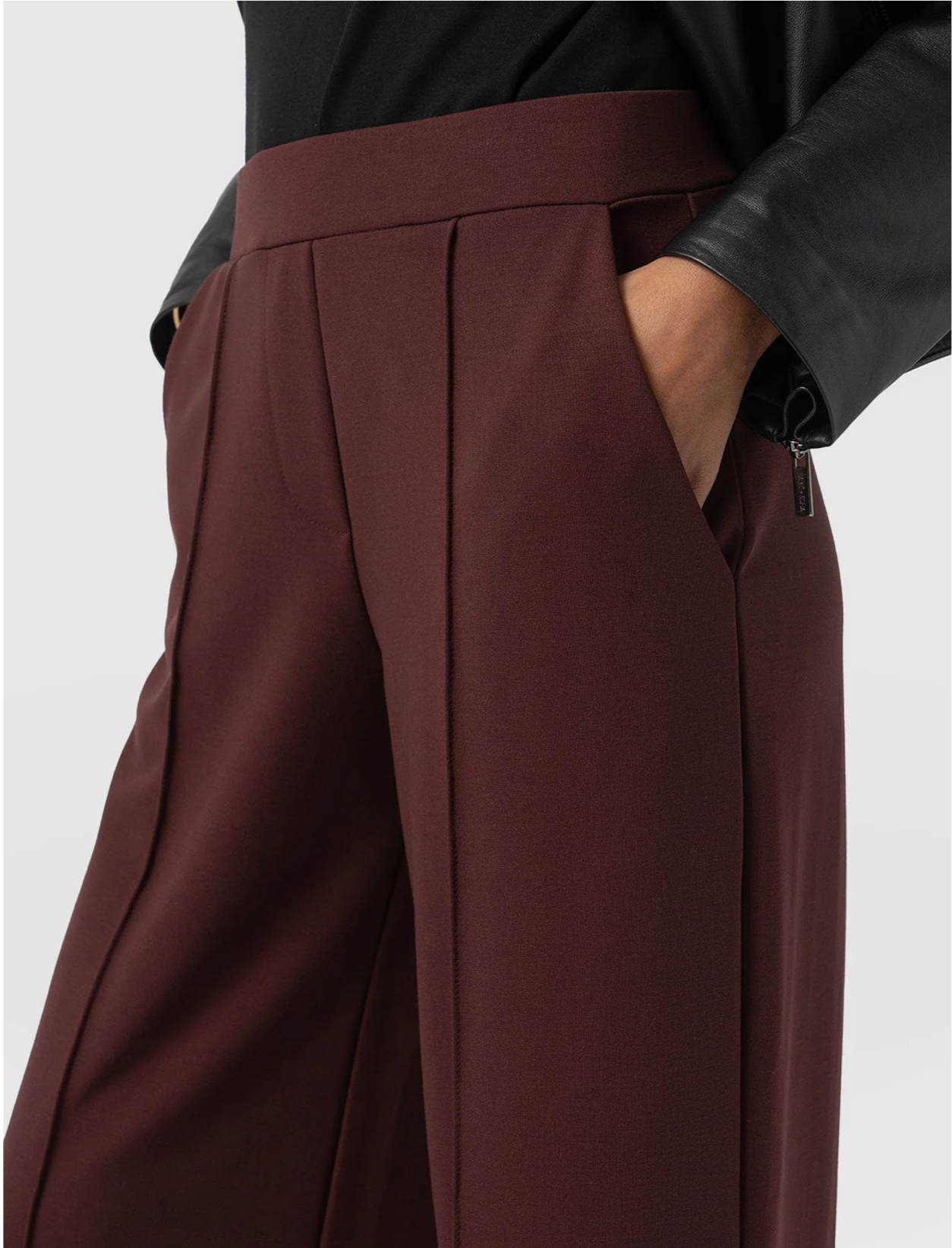 The Saint and Sofia Keller Wide Leg Trousers in burgundy with pintuck detailing down each leg.