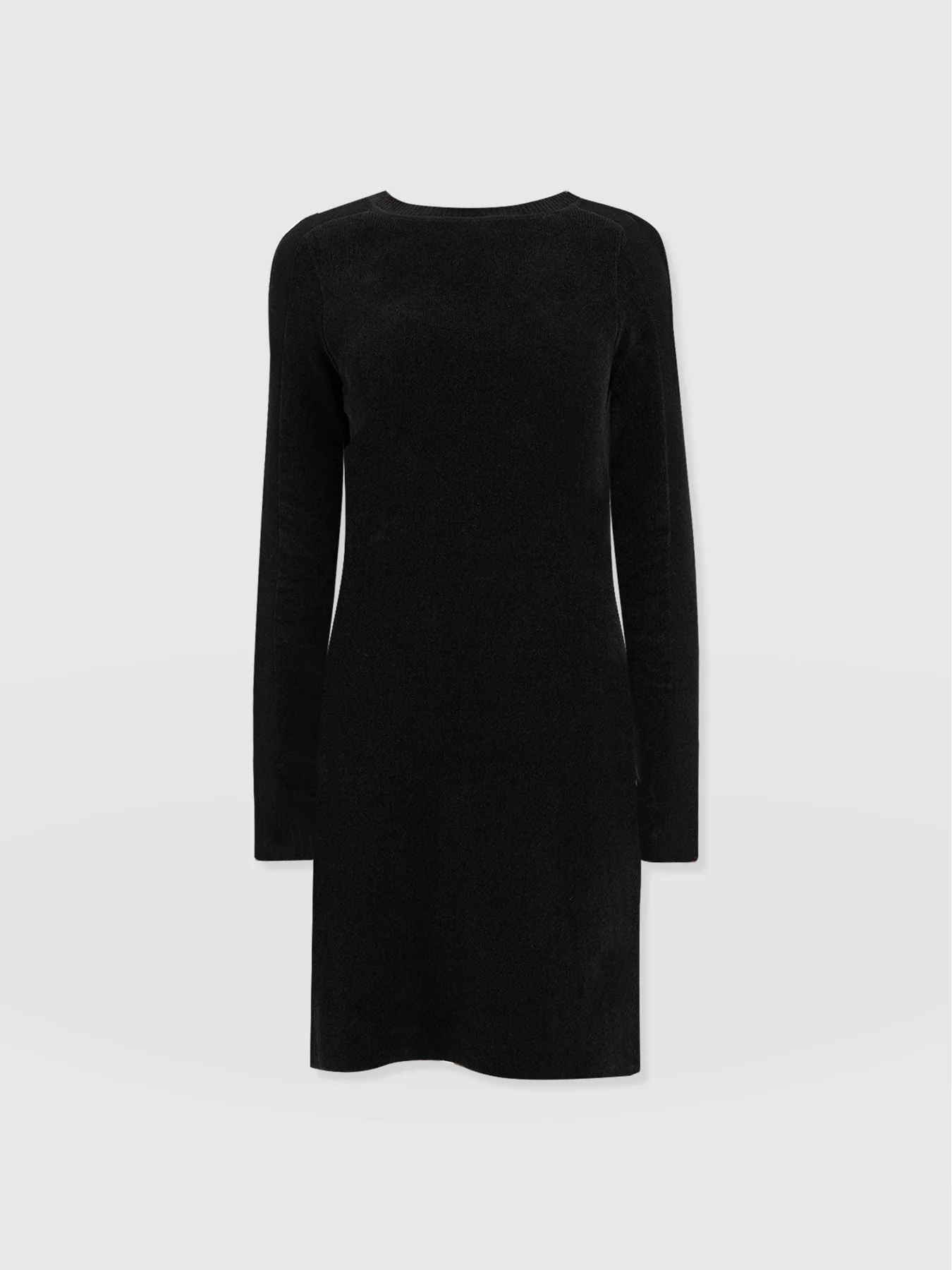The Raya Knit dress from Saint and Sofia's November collection. A black knitted dress with a crew neckline, long sleeves, and a mini-length skirt.