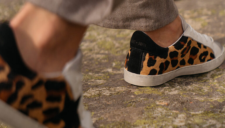 Leopard print suede trainers with a white leather toe cap