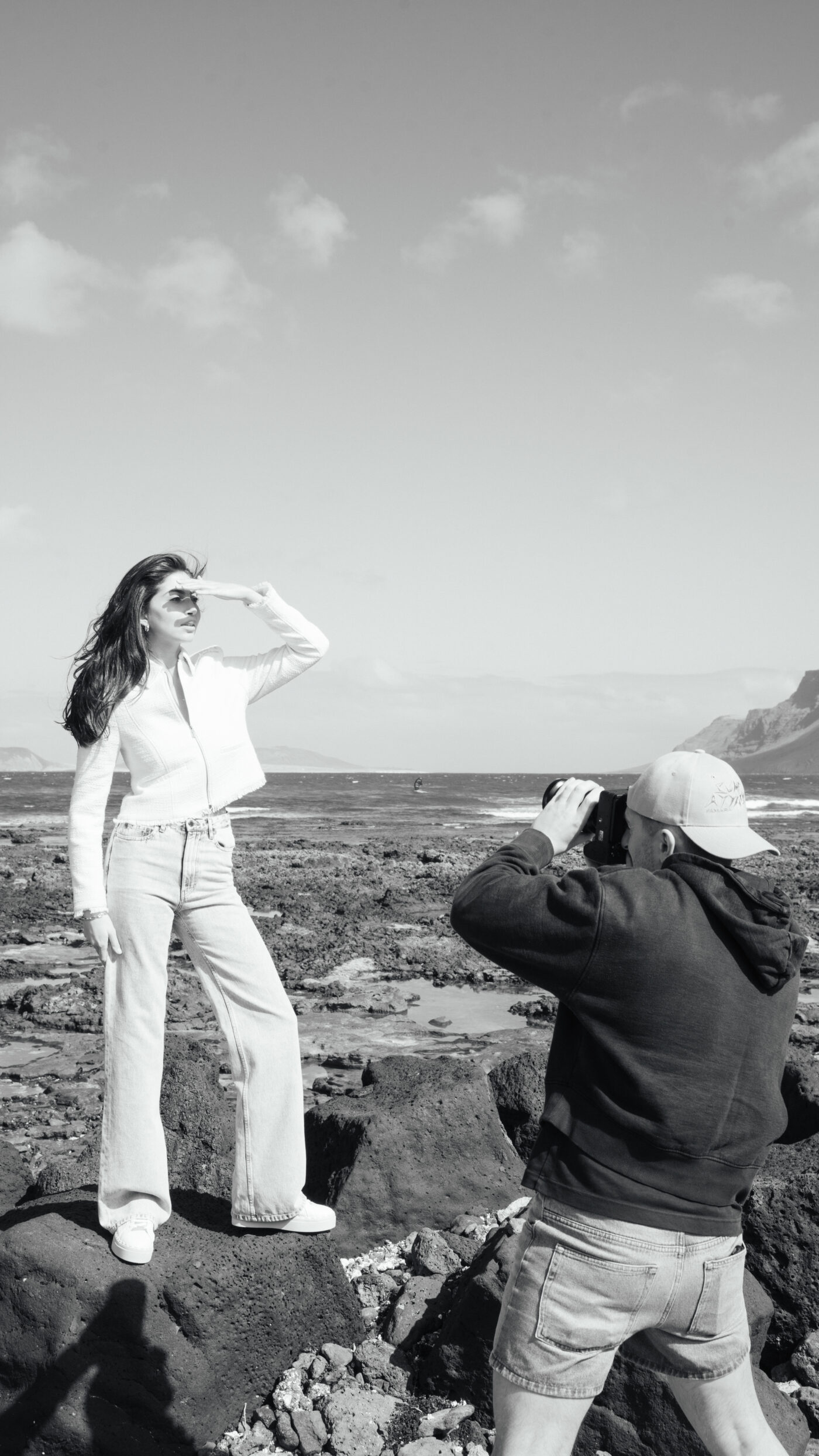 A black and white photo of the Saint and Sofia Head of Creative on a photoshoot with a model