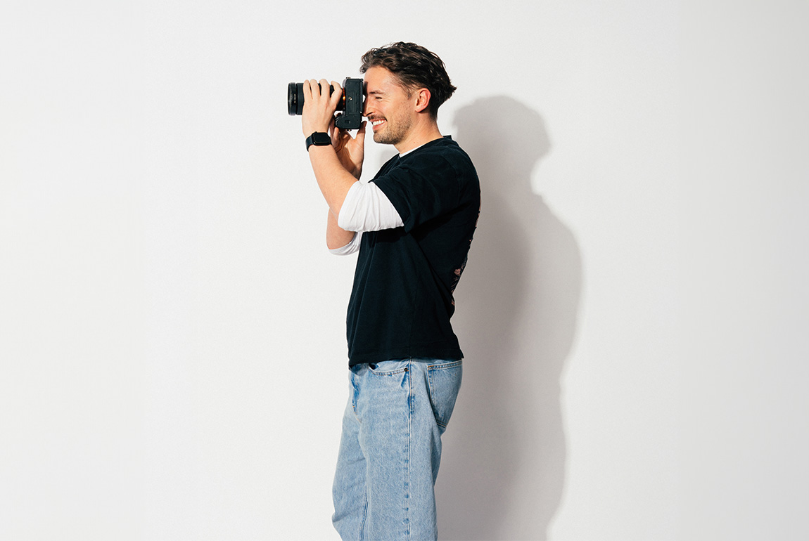 The Head of Creative at Saint and Sofia, Michael Higham, taking a picture