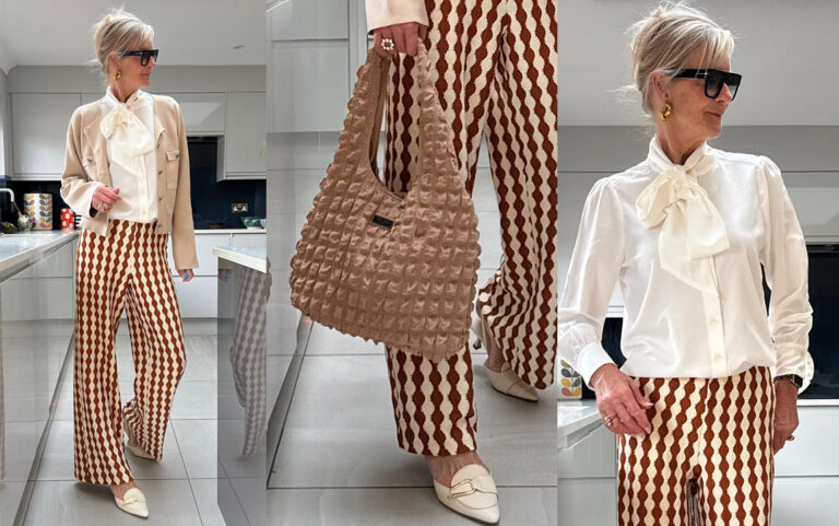 Saint + Sofia x @morag_m competition. This image shows Morag stood in the Saint + Sofia crochet trousers with the Soho Shoulder Tote