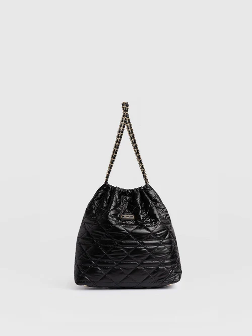 The Camilla Drawstring Tote Bag by Saint and Sofia. A quilted nylon design with a leather and metal chain strap.
