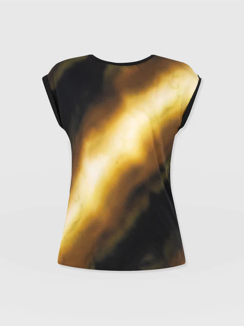 The Saint and Sofia Turn Up Contrast Tee from the May Collection. A crew neck tee with short rolled cap sleeves. At the front, a black and yellow gradient print creates a chic finish while a contrasting jersey back panel provides all-day comfort.