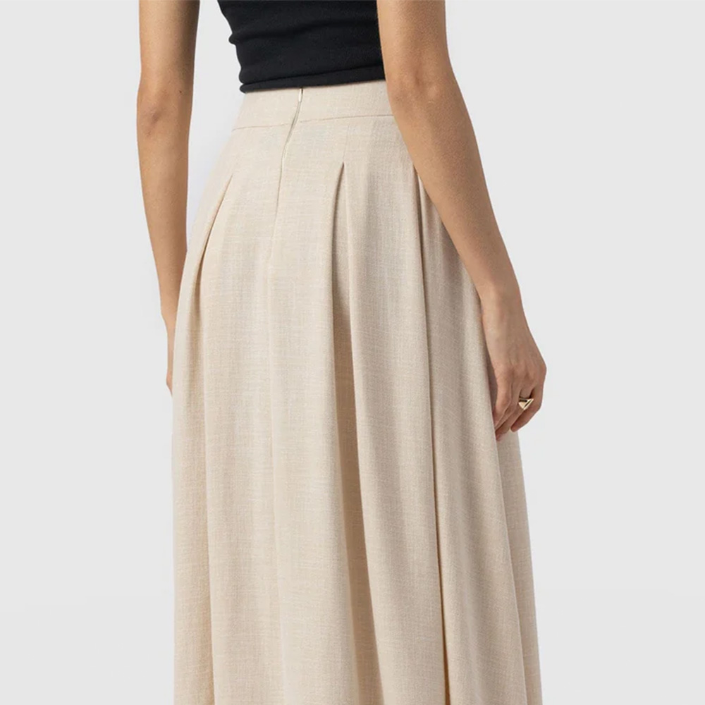 The back of the Eliza midi skirt showing the flat waistband and zipped fastening.