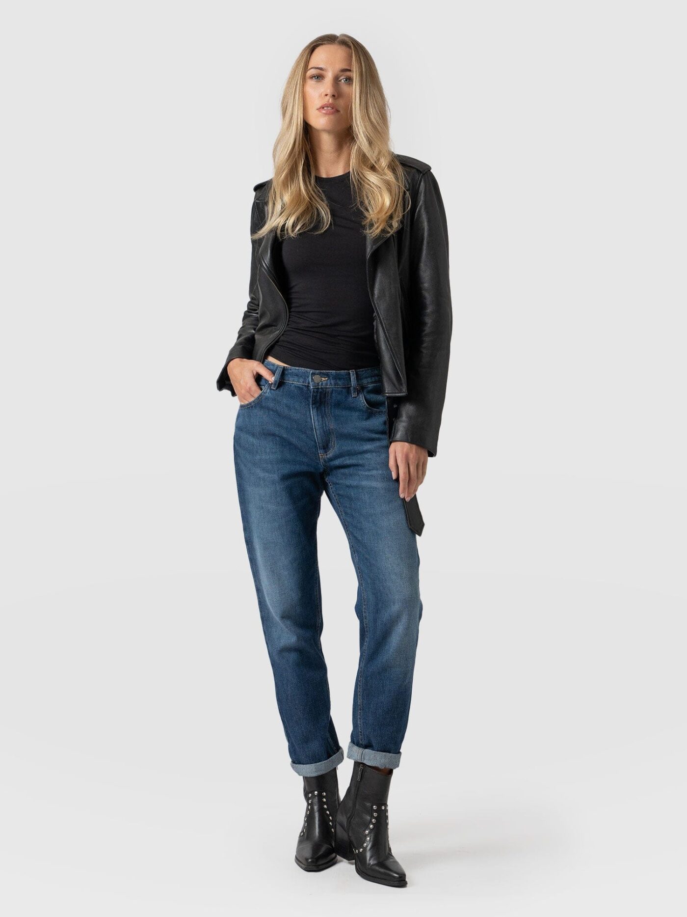 A model wearing a pair of the Boyfriend Jeans by Saint and Sofia. This low rise pair help to lengthen the appearance of your torso.