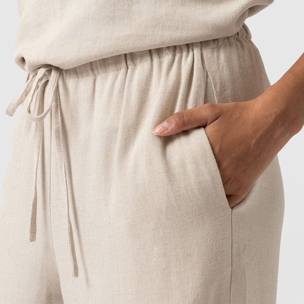 A close up of the Corinne trousers by Saint and Sofia showing the elasticated waistband and slip pockets.