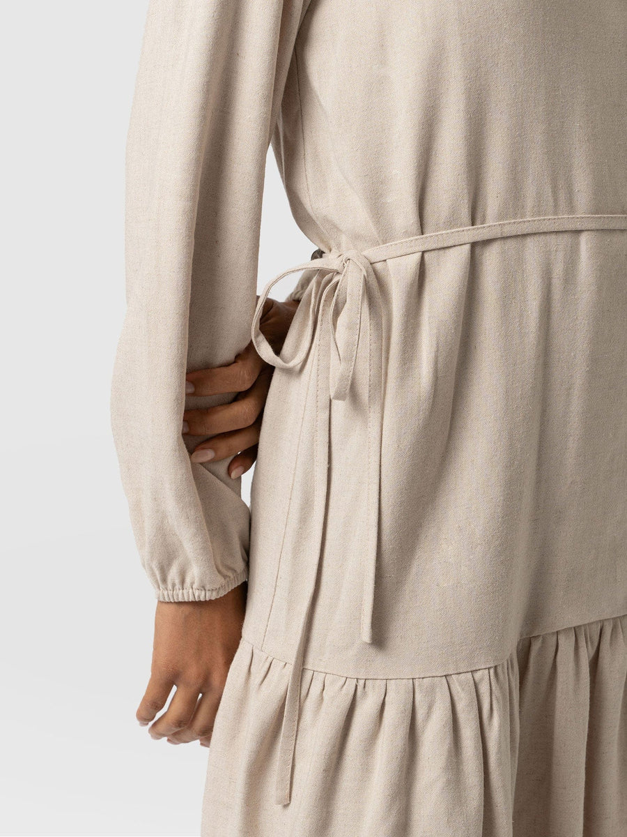 A close up shot of the self tying belt on the Aurelia Linen Mini Dress by Saint and Sofia.