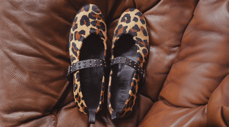 A pair of Saint + Sofia Vega Ballerina Flats in leopard with studded strap details.