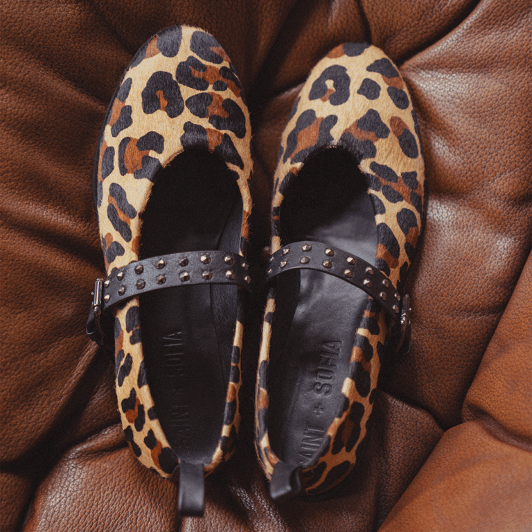 A pair of Saint + Sofia Vega Ballerina Flats in leopard with studded strap details.
