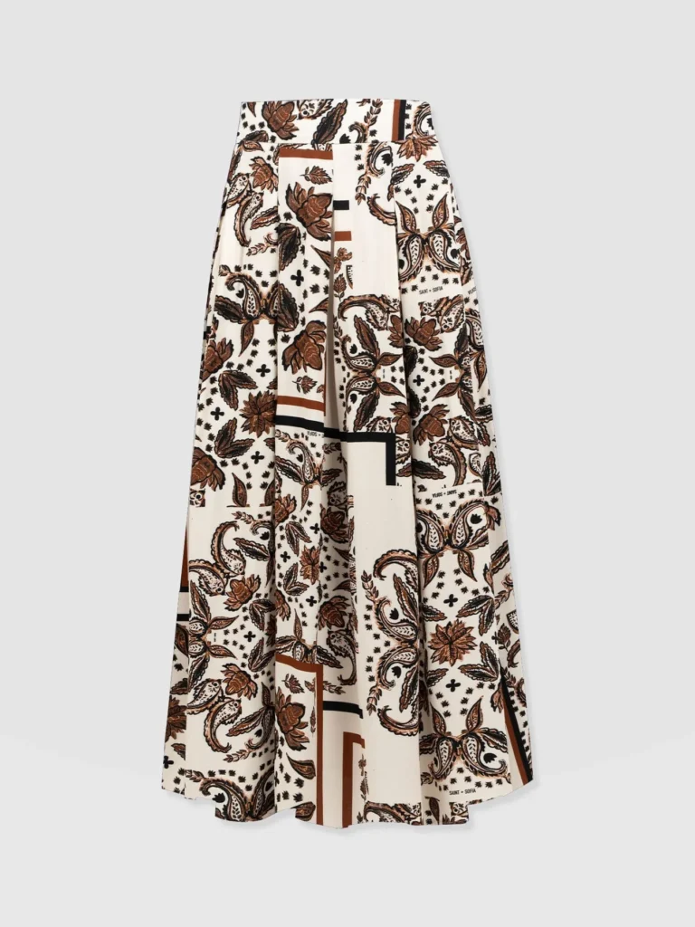 The Saint + Sofia Eliza pleated skirt. A beige and brown paisley print design with box pleats and a flat waistband.
