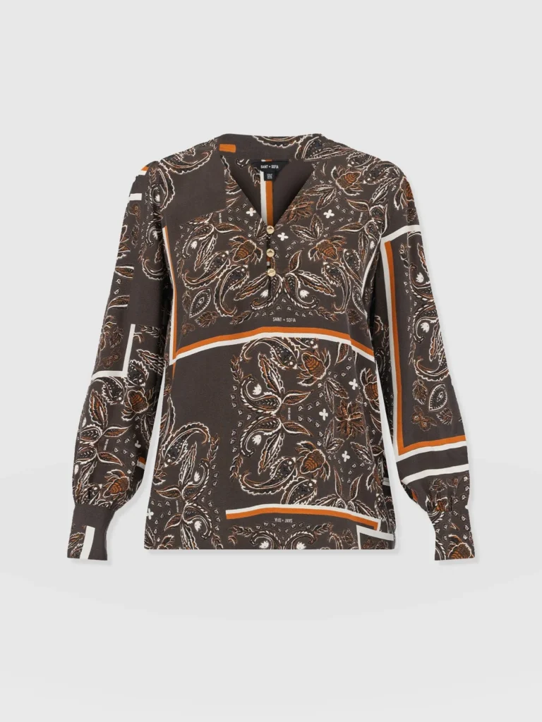 The Saint + Sofia Joselyn Blouse in brown paisley. A v neck design with long sleeves and tailored cuffs.