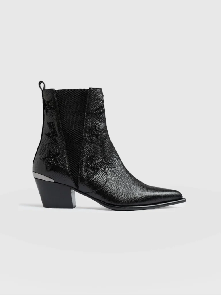 The Saint and Sofia Billie Rock Boot in a black. Leather Chelsea boots with glitter embellished stars and lightning bolts at the side and a block heel.