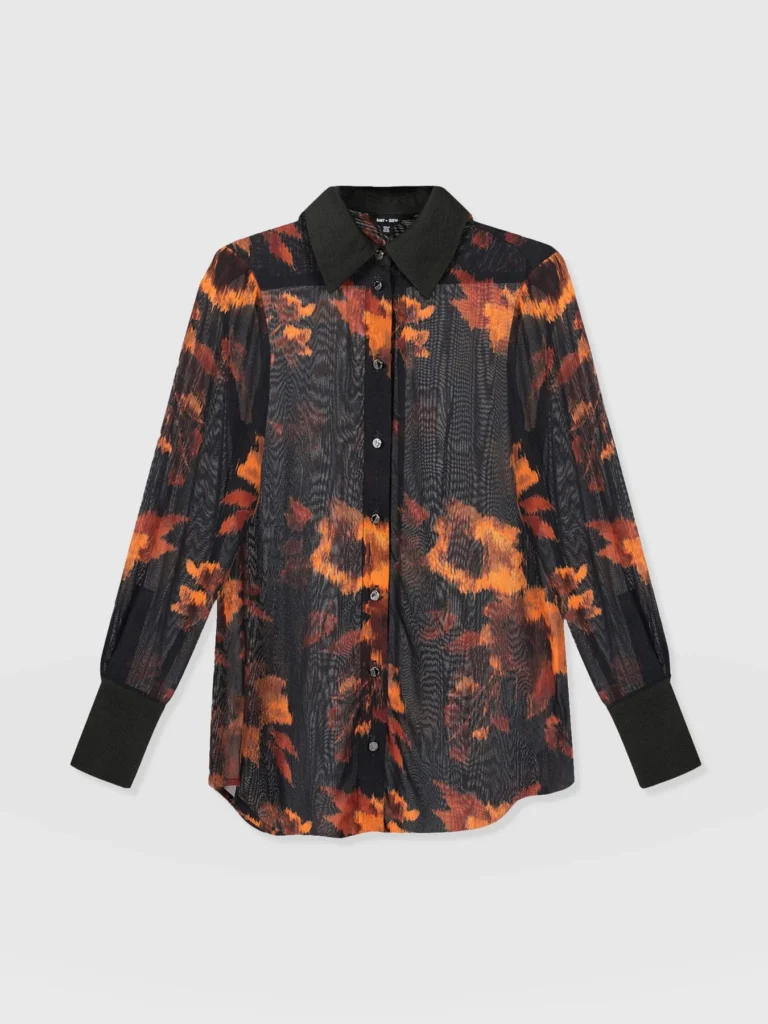 Saint and Sofia's new Madison Shirt in Autumn Floral. A long sleeve, collared, design with buttoned cuffs. Handmade from a semi-sheer georgette fabric and decorated with orange flowers over a black backrgound