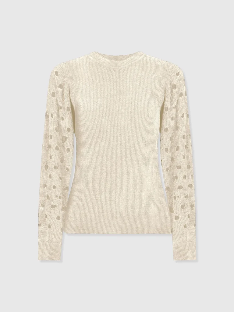 The Suki Lace Hole knit from Saint and Sofia. A cream knitted jumper with a crew neckline, long sleeves with cut out details, and a ribbed finish