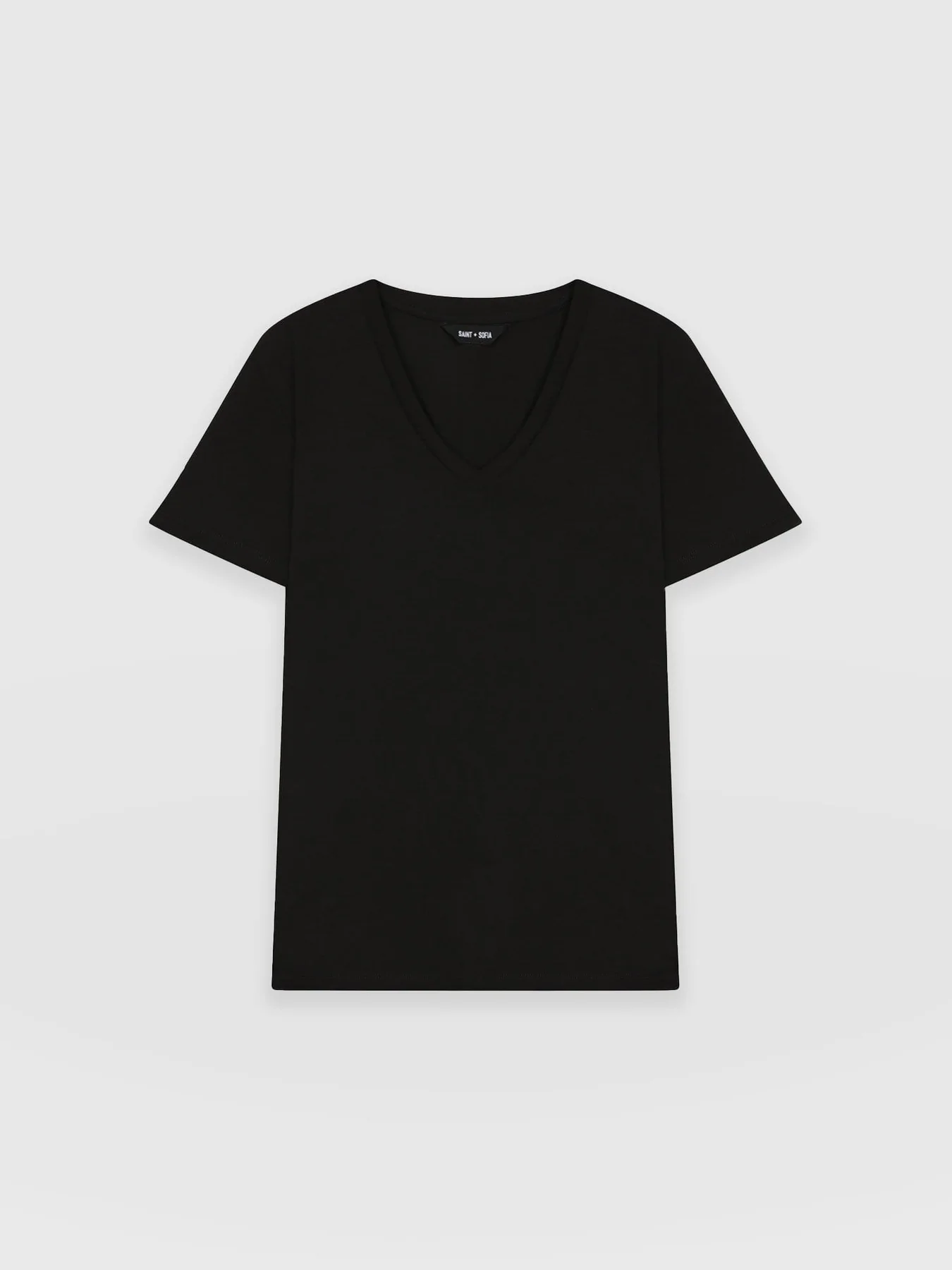A cut out image of the Apartment Tee in Black by Saint and Sofia. A relaxed, V-neck style with short sleeves.