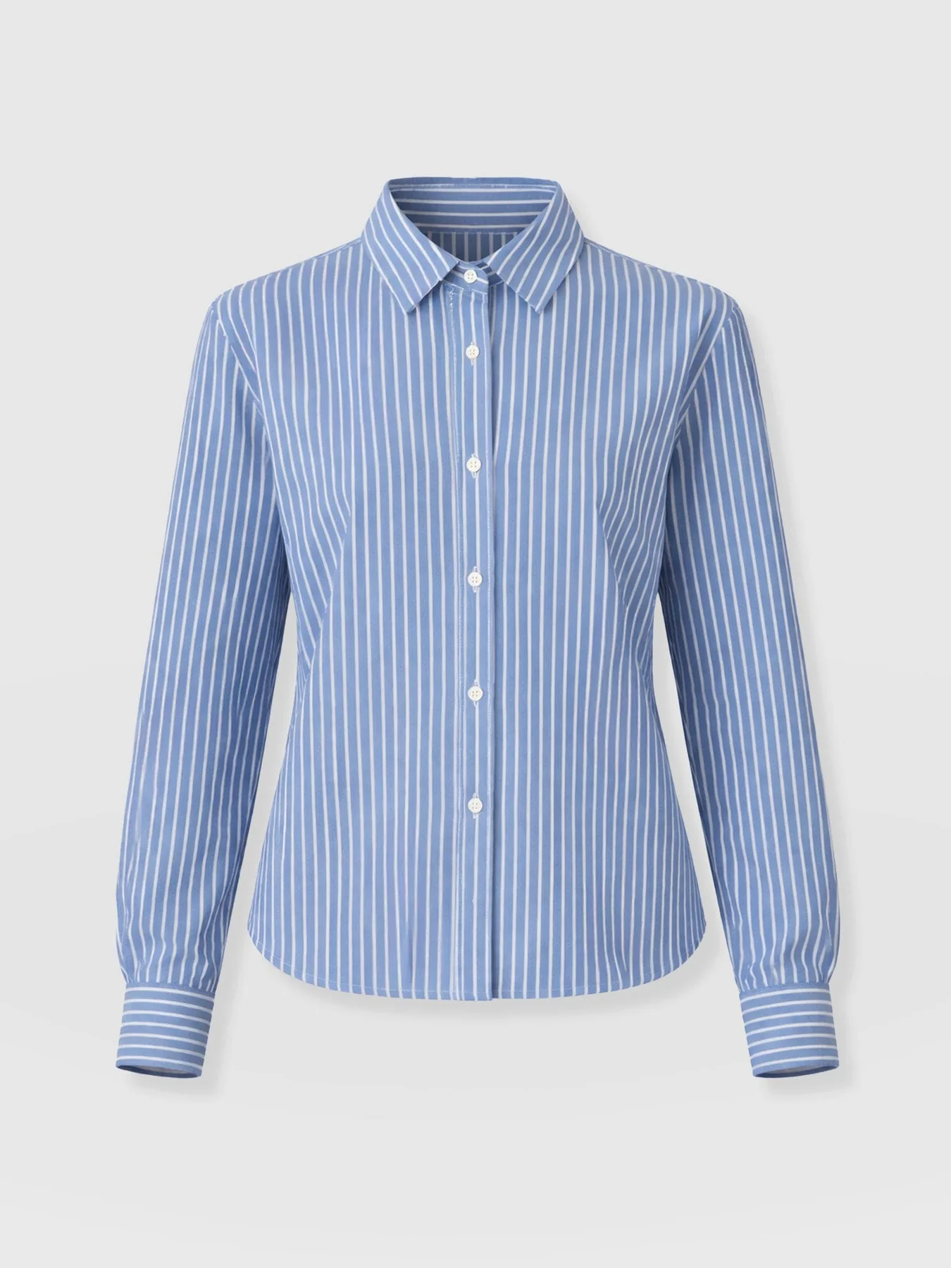 A cut out image of the Anneliese Shirt by Saint and Sofia in blue and white stripe. A buttoned, long-sleeved design with a collared neckline.
